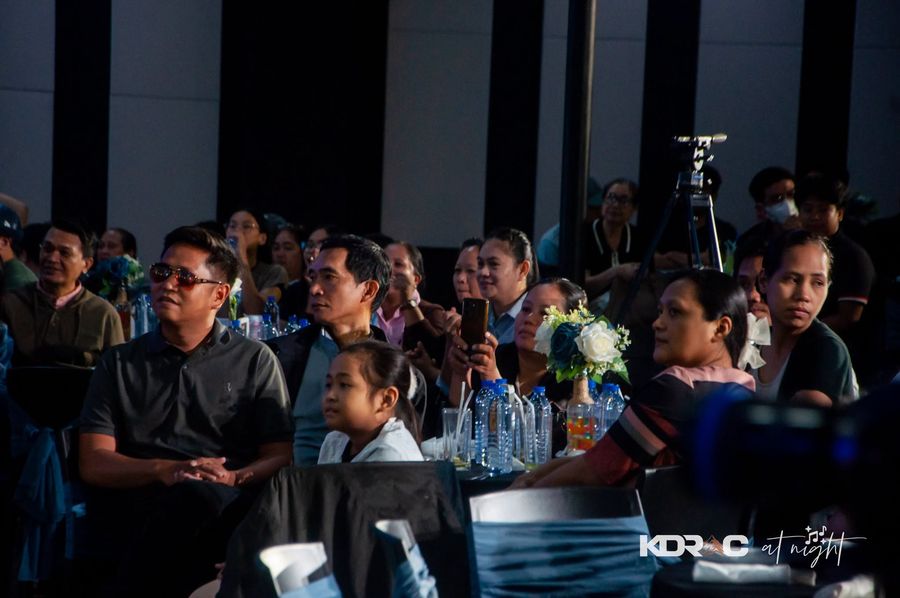 Attendees watching the show from their tables