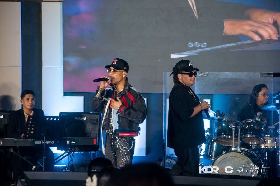 Kris Lawrence and guest singing on stage