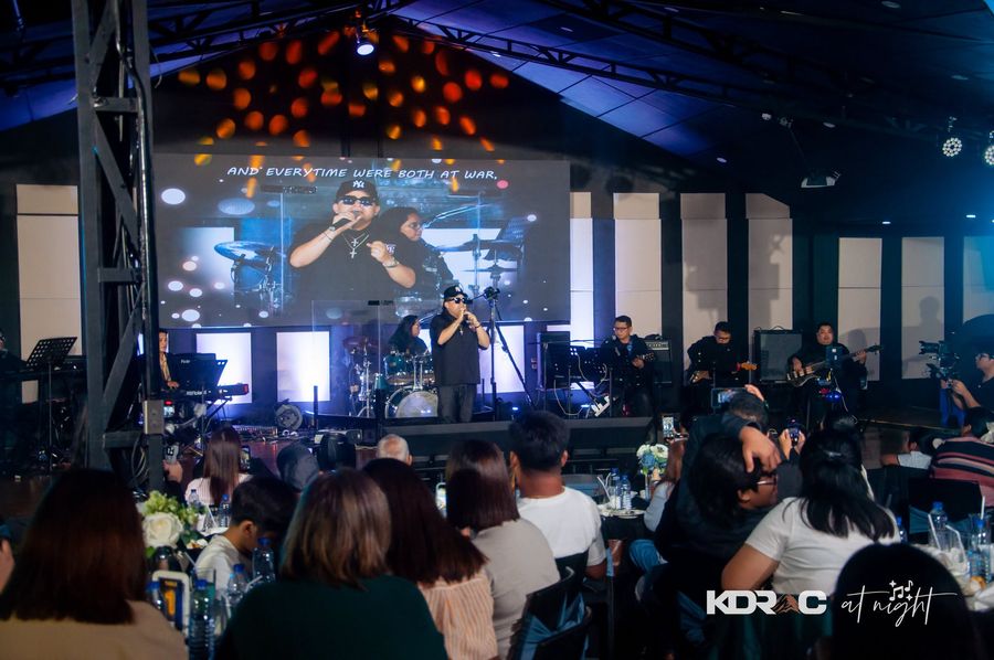 Stage and big screen seen from the dinner tables