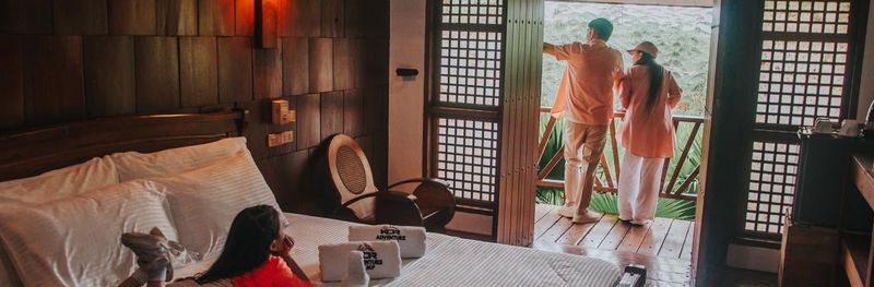 Executive Cottage bedroom with a balcony view